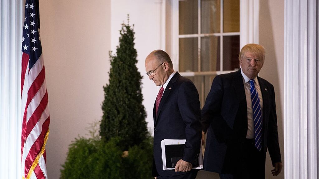 Andrew Puzder, chief executive of CKE Restaurants, with president-elect Donald Trump: Mr Pudzer has staunchly defended his company’s notorious advertising. Photograph: Drew Angerer/Getty Images
