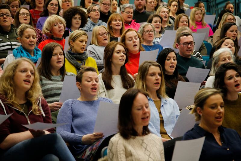 Members of the choir read from hymm sheets. Song selections comes from a range of genre including classics from the 1980s and 1990s right up to modern pop, rock and R&B tracks. Photograph Nick Bradshaw for The Irish Times