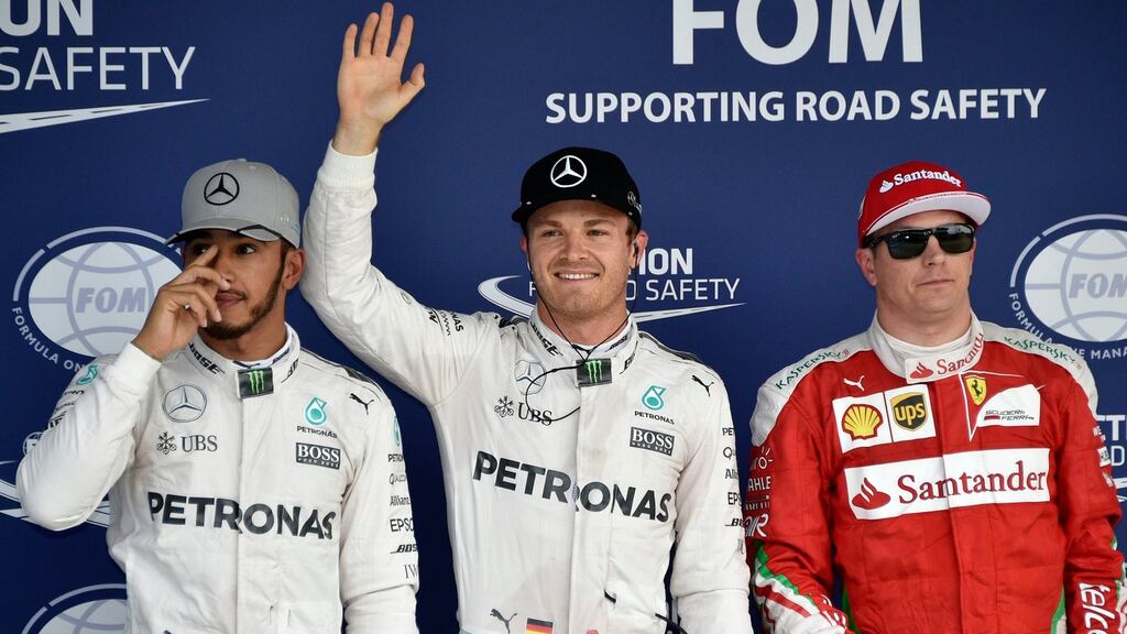 Pole sitter German Formula One driver Nico Rosberg (C) of Mercedes AMG GP waves to the crowd with second placed Lewis Hamilton (L) of Mercedes AMG GP and Kimi Raikkonen Scuderia Ferrari at the end of the qualifying session for the Japanese Formula One Grand Prix at the Suzuka Circuit in Suzuka, central Japan. Photo: PA