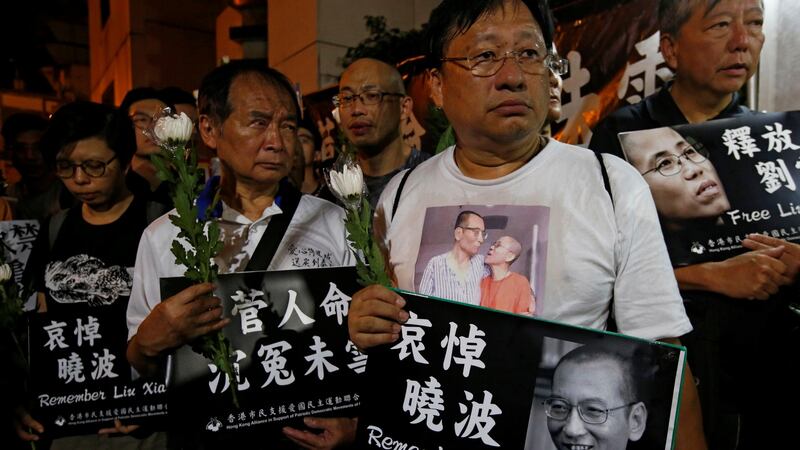Pro-democracy activists mourn the death of Nobel Laureate Liu Xiaobo outside China’s Liaison Office in Hong Kong, China, July 13th, 2017. Photograph: Bobby Yip/Reuters