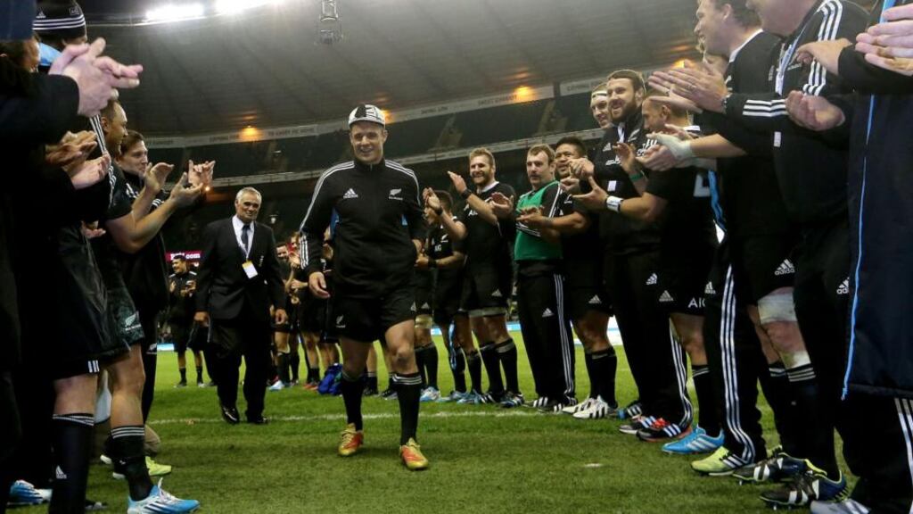 The New Zealand team applaud Dan Carter off the field after he won his 100th Test cap against England at Twickenham. Photograph: James Crombie/Inpho