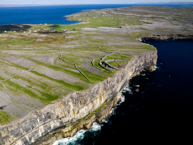 On Inishmore, the largest of the Aran Islands, you'll not only discover stunning coastal views but also plenty of fluent Irish speakers
