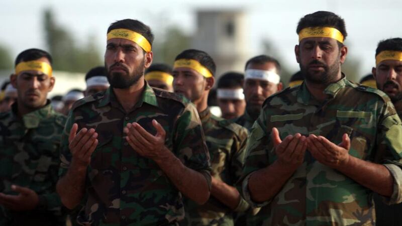 Members of a Shia militia pray near Ramadi. Photograph: Alaa Al-Shemaree/ EPA