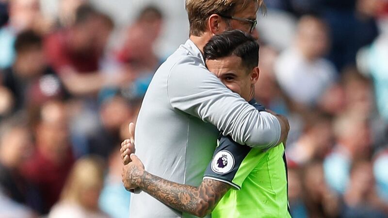 Liverpool manager Jürgen Klopp embraces his star player Philippe Coutinho. This hug felt a little different: tighter, longer, stronger. A thank-you in physical form and perhaps even the warmest of pleas to the Brazilian to stay. Photograph: Peter Nicholls/Reuters