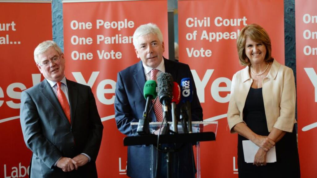 Minister of State Alex White (centre) and Minister for Social Protection Joan Burton (right) are the only contenders yet to announce that they want to succeed Eamon Gilmore (left) as Labour leader. Photograph: Alan Betson/The Irish Times.