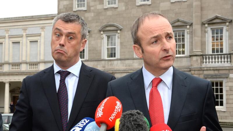 Picture 2: Former Labour TD Colm Keaveney on the plinth at the Dáil with Fianna Fail leader Micheál Martin after his announcement that he was joining Mr Martin’s party. Photograph: Cyril Byrne/The Irish Times