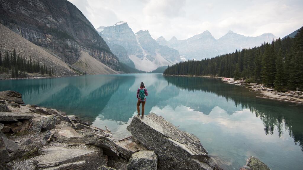 A woman overlooking Moraine Lake in Alberta, Canada. Photograph: Jordan Siemens