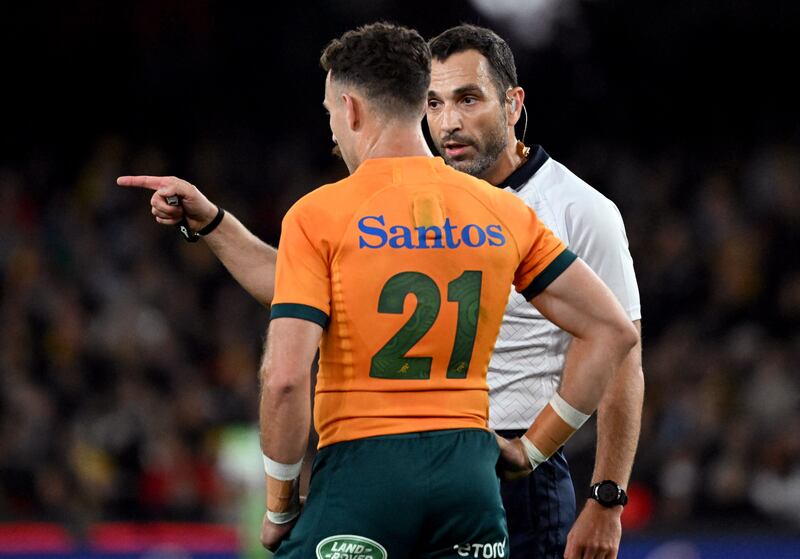 Australia's Nic White speaks with referee Mathieu Raynal after the controversial late call in the Bledisloe Cup clash between Australia and New Zealand in Melbourne. Photograph; William West /AFP via Getty Images