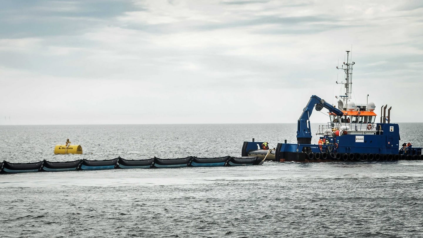 The first prototype of ‘The Ocean Cleanup’ is installed off the Dutch coast near Scheveningen, The Netherlands. Dutch Dredging and Marine experts company ‘Royal Boskalis Westminster’ together with the Dutch government contributeed €1.5 million to the project by Dutch inventor Boyan Slat. Photograph: EPA/REMKO DE WAAL