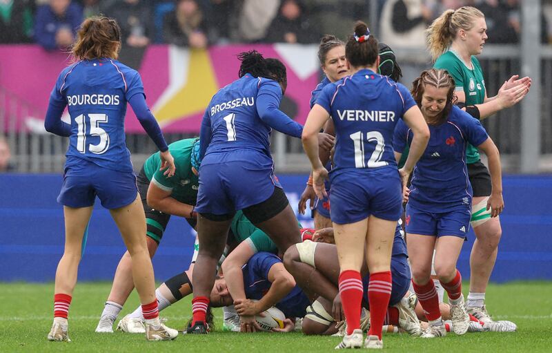 France’s Axelle Berthoumieu holds the arm of Aoife Wafer of Ireland. Photograph: Ben Brady/Inpho
