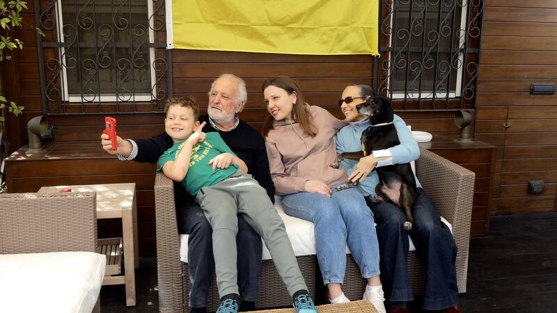 Yuliia Gavryliuk (centre) with her Italian host family: From Kyiv, Gavryliuk says integration to Italy has been difficult, but she has been helped by the welcome from her Italian host, and her job as a mediator with the non-profit Refugees Welcome Italy.