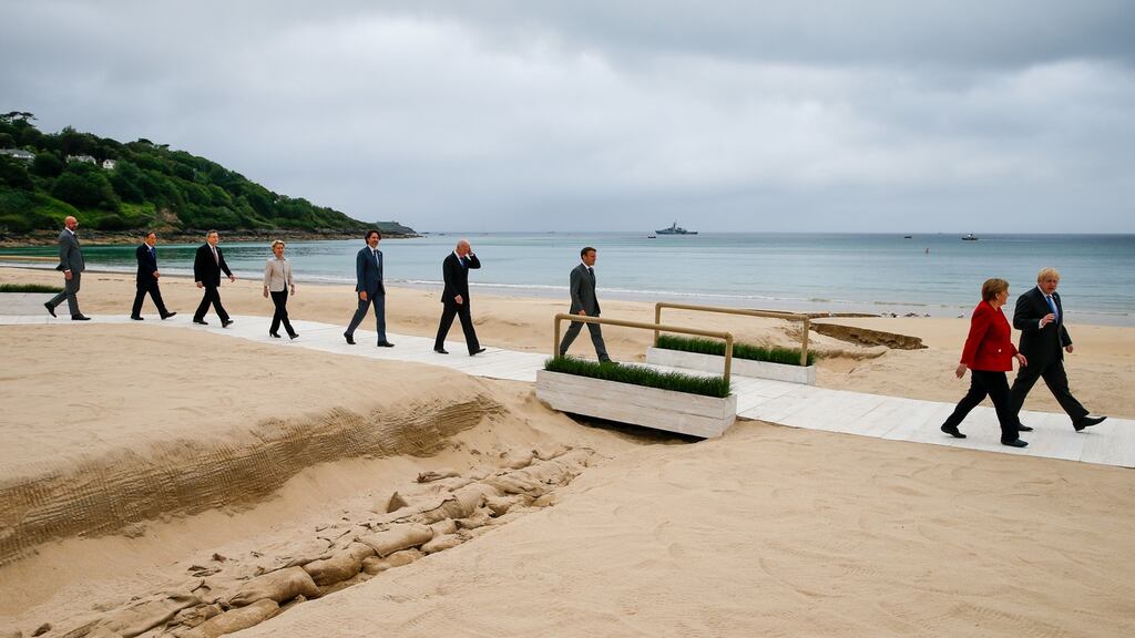 Angela Merkel and Boris Johnson lead other G7 leaders in a walk in Carbis Bay, Cornwall, on Friday, ahead of the G7 summit. Photograph: Hollie Adams/Bloomberg