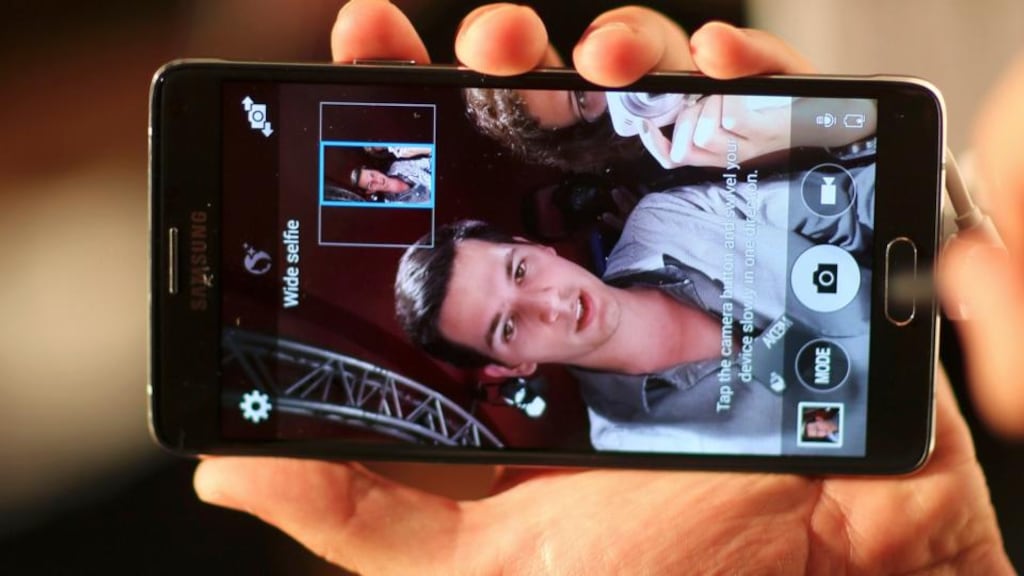 Samsung Galaxy Note 4’s front-facing camera offers a “selfie option” that makes your skin look great. Photograph: Hannibal Hanschke/Reuters