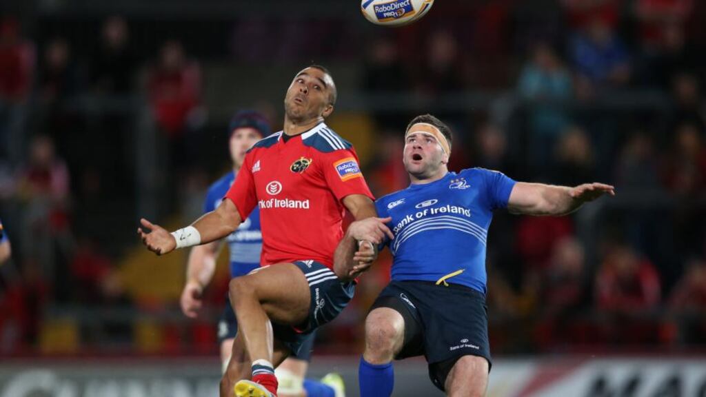 Simon Zebo of Munster competing with Leinster’s Fergus McFadden. Zebo should be back for the end of Munster’s Heineken Cup campaign. Photograph: Billy Stickland/Inpho
