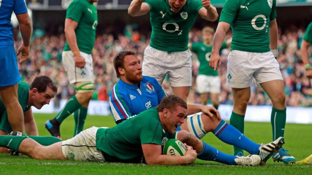 Jack McGrath celebrates Ireland’s seventh and last try against Italy. Photograph: Cathal McNaughton/Reuters