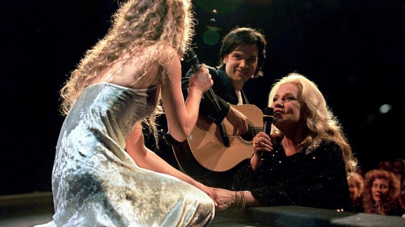 Jeanne Moreau (right), president of the jury at the 48th Cannes Film Festival, sings with Vanessa Paradis as part of the opening evening program of the festival in Cannes, France, May 17, 1995. Photograph: Reuters/Stringer