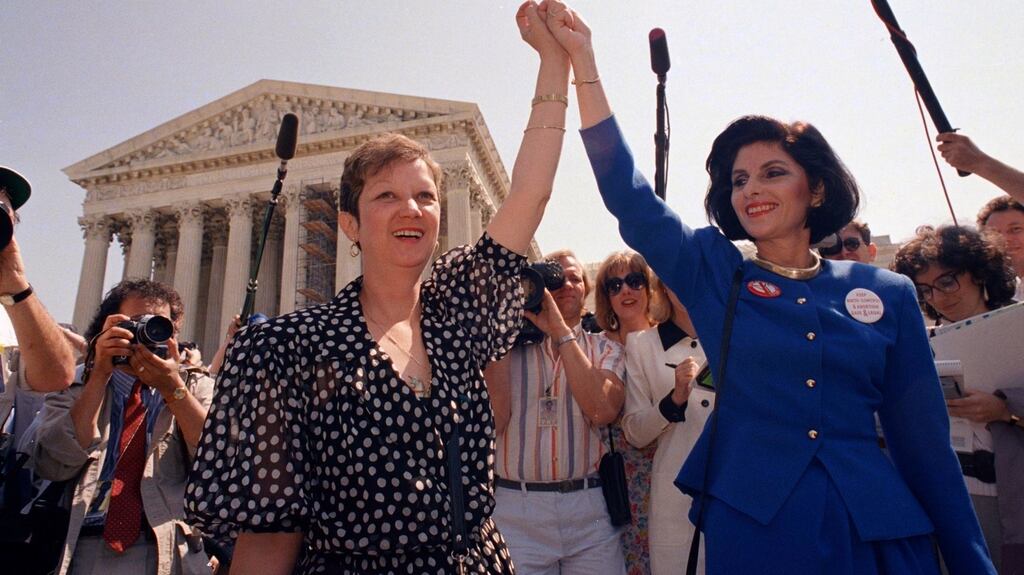 In this April 26, 1989 file photograph, Norma McCorvey, Jane Roe in the 1973 court case, (L), and her lawyer  Gloria Allred hold hands as they leave the Supreme Court building in Washington after sitting in while the court listened to arguments in a Missouri abortion case. Photograph: AP