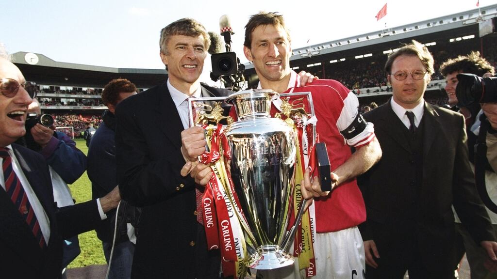 Arsène Wenger and Tony Adams with the Premier League trophy in 1998. Photograph: Ben Radford/Getty