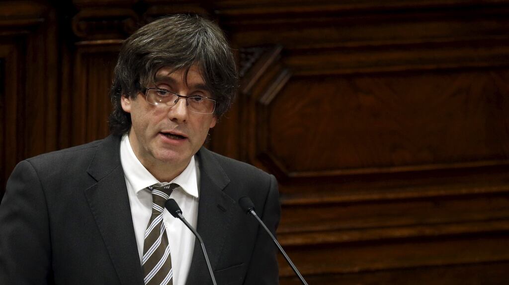 Catalan premier Carles Puigdemont delivers a speech during his investiture at the Catalunya parliament in Barcelona on Sunday evening. Photograph: Albert Gea/Reuters