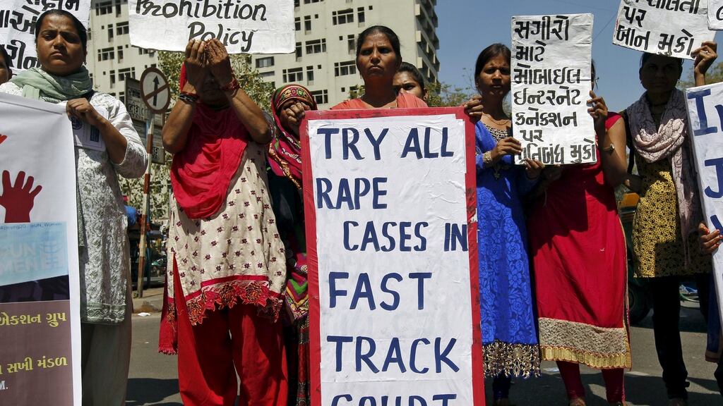 Activists from a local women’s organisation hold placards during a protest as they mark International Women’s Day in Ahmedabad, India on Tuesday. Photograph: Reuters