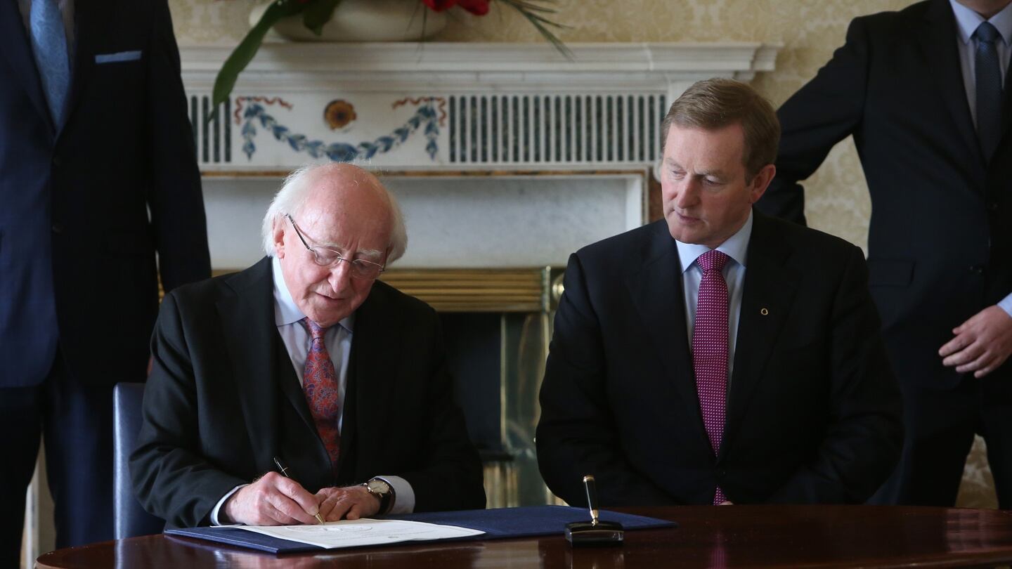 Newly elected Taoiseach Enda Kenny (right) with President Michael D. Higgins at Aras an Uachtarain as he received his seal of office. Photograph: Brian Lawless/PA Wire.