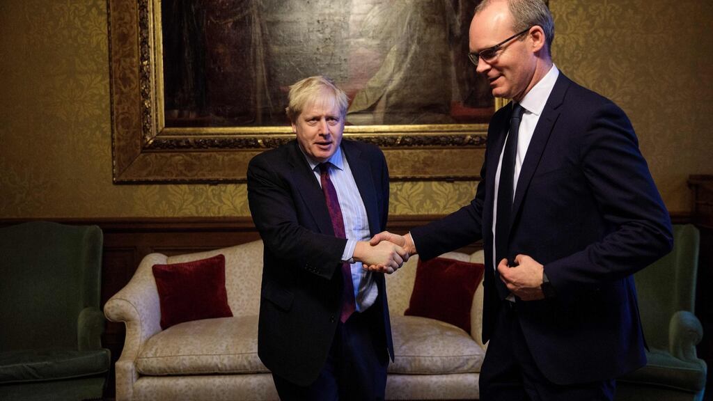 Tánaiste Simon Coveney (right) said the EU position on Brexit would not change with a new prime minister, suggesting that the stated aim of Boris Johnson (left), to renegotiate the Withdrawal Agreement would put him on a collision course with the EU. File photograph: Jack Taylor/AFP/Getty Images.
