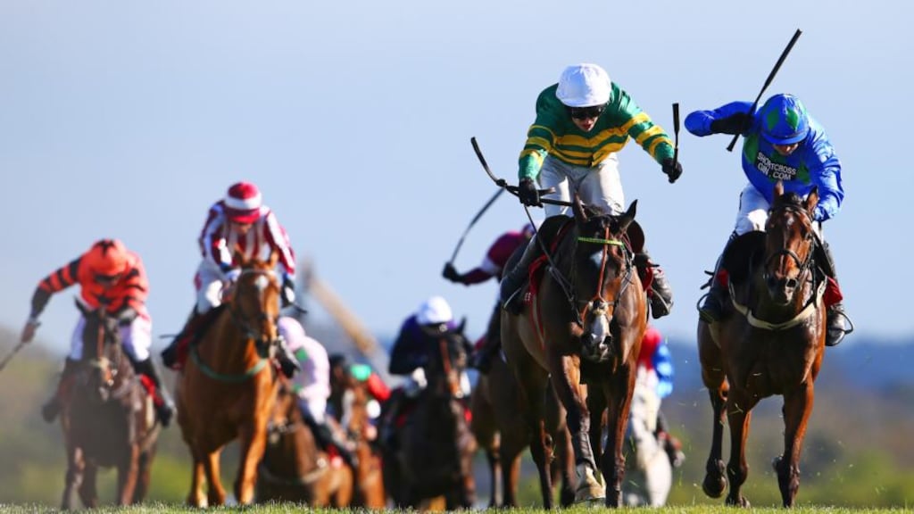 Mark Walsh and Jezki hold off Ruby Walsh and Hurricane Fly to win the Ladbrokes World Series Hurdle at Punchestown. Photograph: Cathal Noonan/Inpho.
