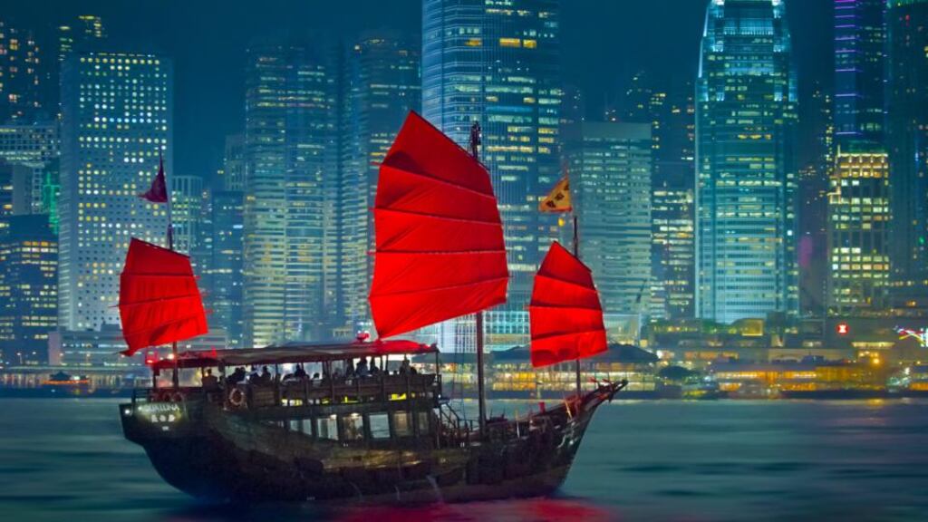 Take the pulse of the city on a trip between Kowloon and Hong Kong island. Photograph: Getty