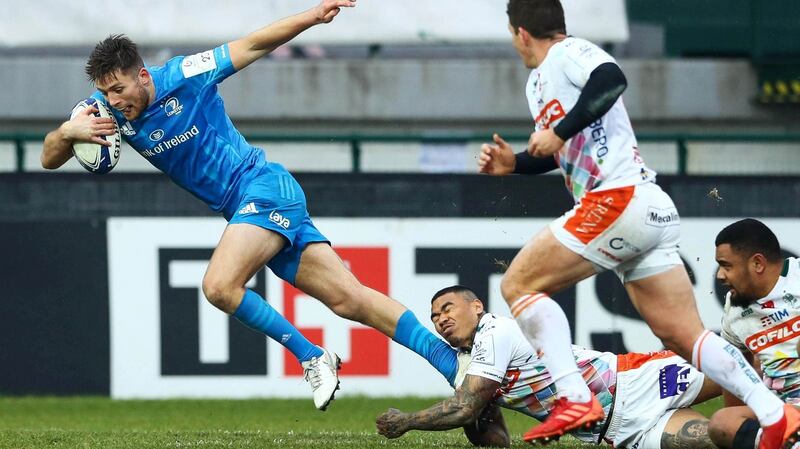 Leinster’s Ross Byrne is tackled by Monty Loane of Benetton. Photo: Matteo Ciambelli/Inpho