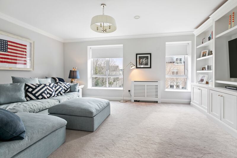 Entertainment room on the first floor has built in units.