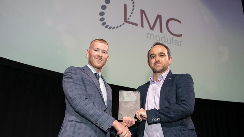Neil Wall, Head of Entries at BusinessRiver, presents the Health & Safety Excellence Award - Manufacturing award to Brian O' Donoghue, LMC Modular.