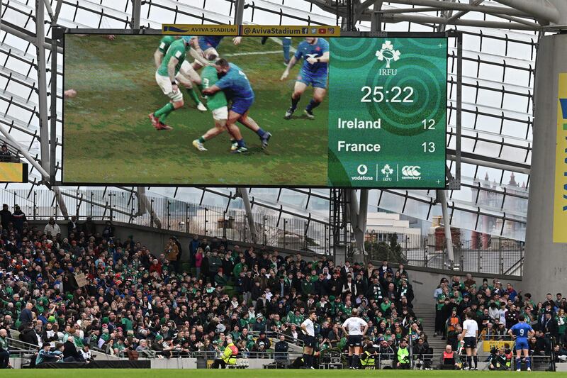 Referee Wayne Barnes studies the screen after a tackle from France prop Uini Atonio on Ireland hooker Rob Herring, for which he was given a yellow card. Photograph: Paul Ellis/AFP via Getty Images