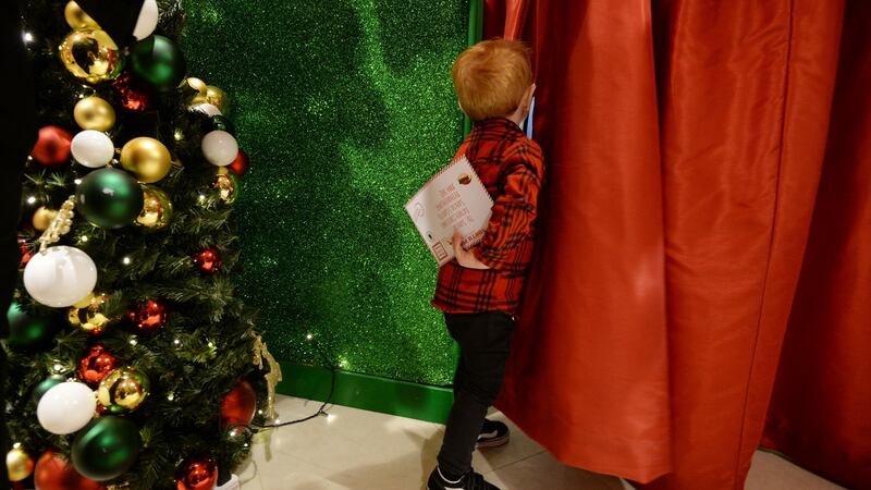 Leo O’Keeffe (two and a half) from Tallaght is about to deliver his Santa letter at Arnotts. Photograph: Alan Betson