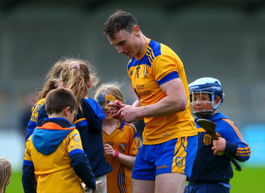 Na Fianna's Liam Rushe takes time to sign autographs at the end of the game. Photograph: Ken Sutton/Inpho