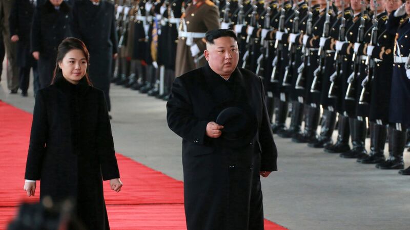 North Korean leader Kim Jong-un and his wife Ri Sol-ju reviewing a guard of honour in Pyongyang before leaving for a visit to China. Photograph: EPA