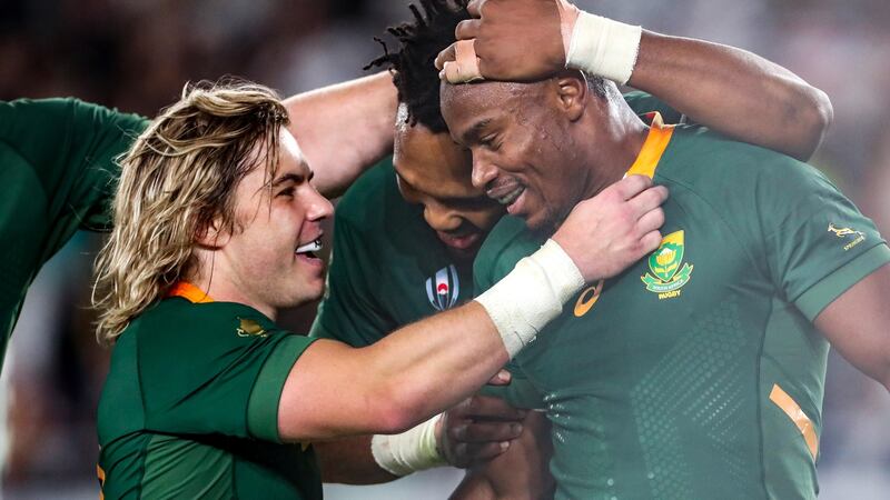 Faf de Klerk and Lukhanyo Am celebrate Makazole Mapimpi’s try against England. Photograph: Billy Stickland/Inpho