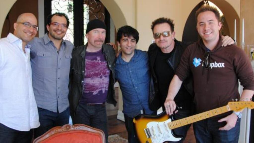 U2 guitarist Edge and singer Bono with representatives of Dropbox, in which they have invested.
