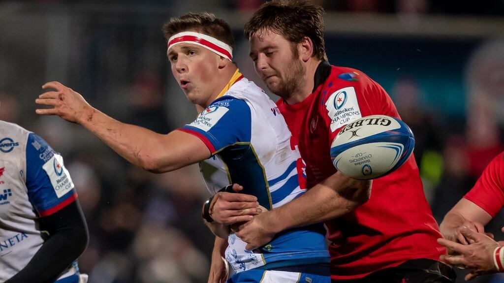 Ulster’s Iain Henderson tackles Josh Helps of Scarlets during the Heineken Champions Cup match at the Kingspan stadium. Photograph: Morgan Treacy/Inpho