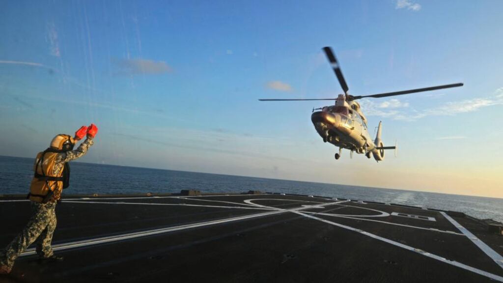 A Chinese military helicopter flies off the deck of Singapore’s navy missile frigate during a joint exercise by the Singaporean and Chinese navies in the South China Sea yesterday. Photograph: Then Chih Wey/Xinhua via AP
