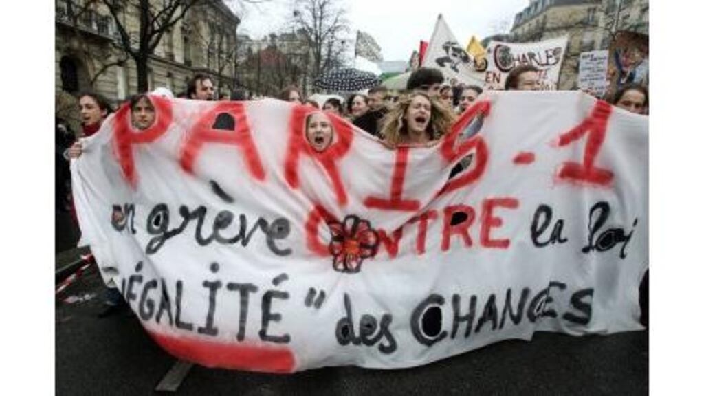French students shout slogans during a nationwide protest demanding the government scrap a contentious youth jobs law in Paris yesterday. French public transport workers and teachers staged a one-day national strike and tens of thousands took to the streets to try to force Prime Minister Dominique de Villepin to abandon the law.
