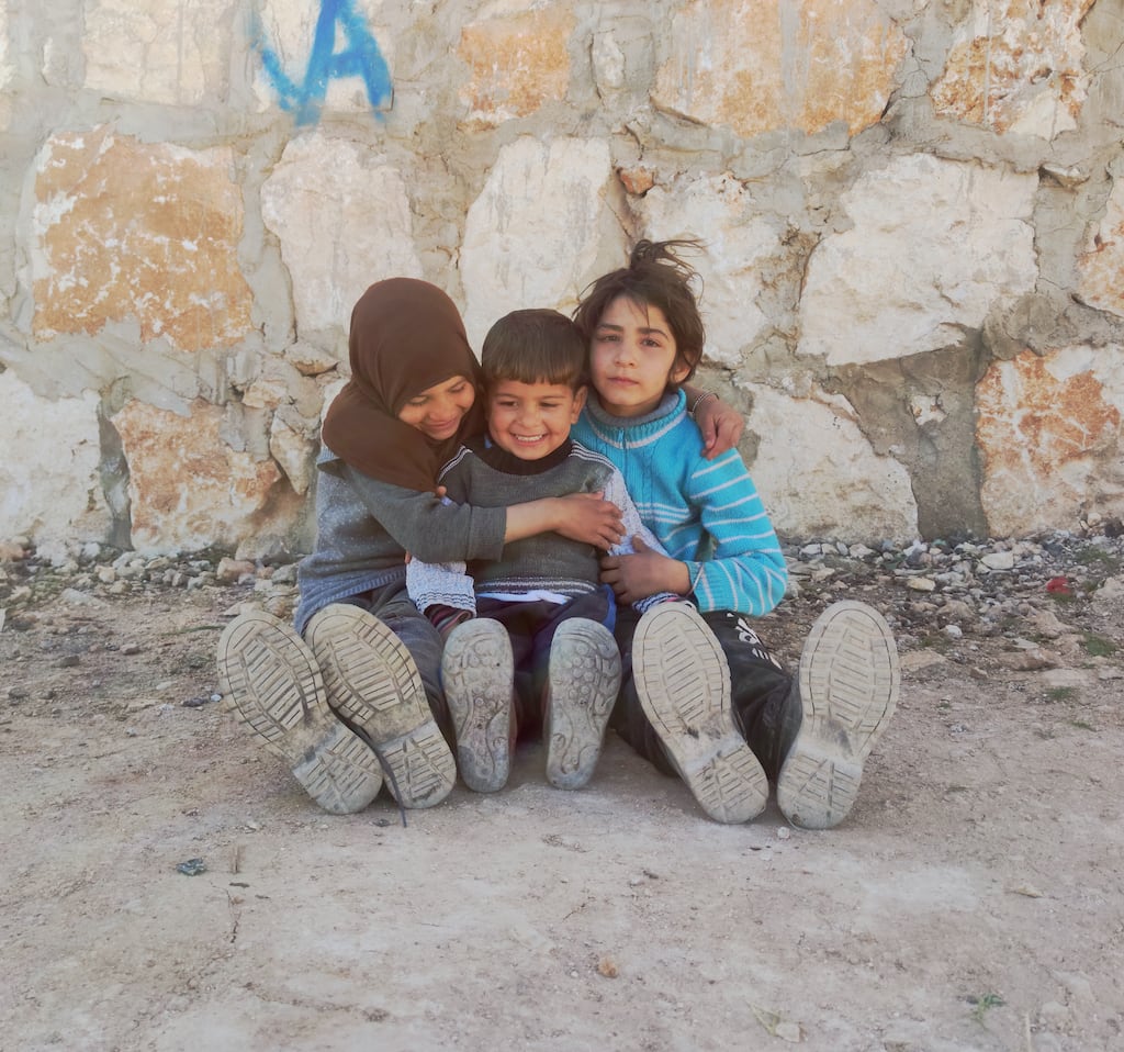 Hamoud’s granddaughter Leila (10) with her brother Ali (5) and sister Zainab (8). Idleb, Syria. February 2024