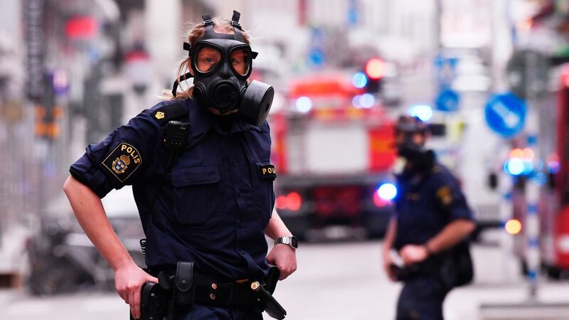 Police officers work at the scene where a truck crashed into the Ahlens department store at Drottninggatan in central Stockholm. Photograph: Getty Images