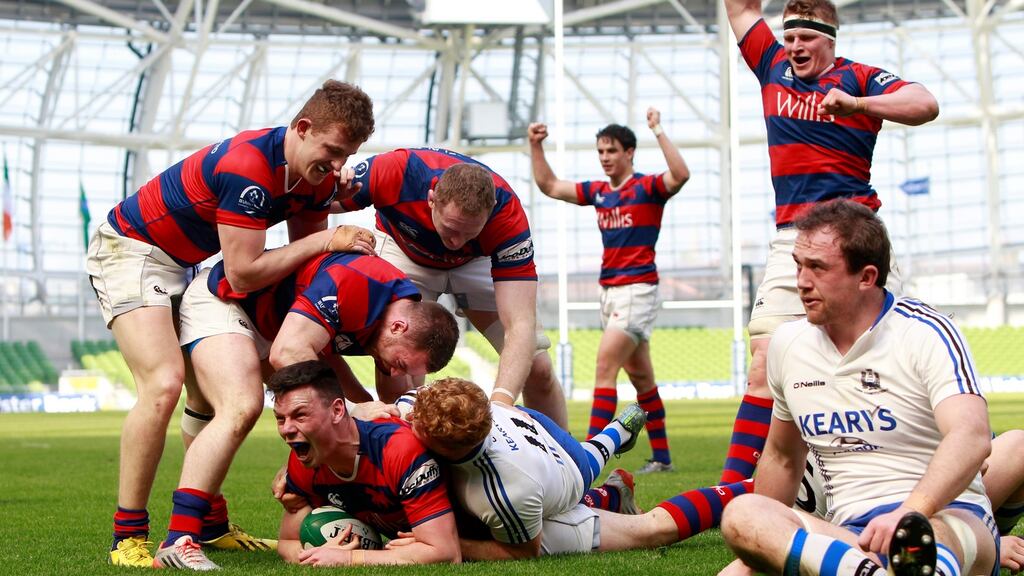 Clontarf celebrate as Matt D’Arcy goes over for a try against Cork Con during last year’s final. Photograph: Colm O’Neill/Inpho