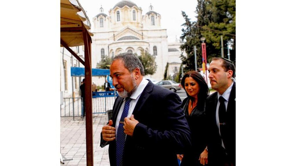 Avigdor Lieberman (left), former Israeli foreign minister, arrives at Jerusalems magistrate court yesterday. photograph: baz ratner/reuters