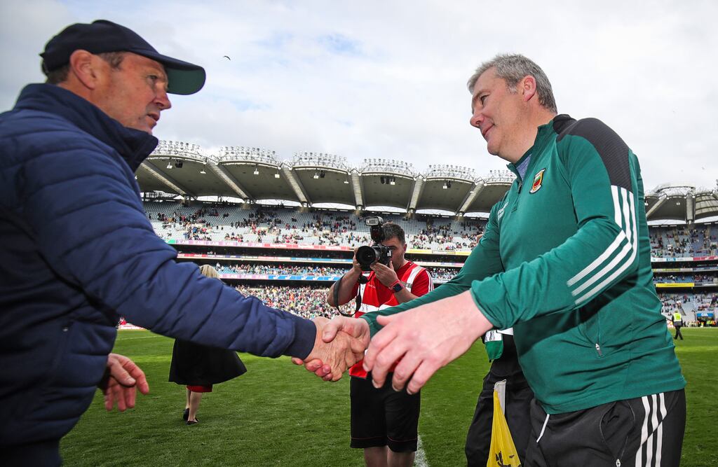 Jack O'Connor greets James Horan after Kerry's victory over Mayo in the All-Ireland quarter-final. Photograph: Evan Treacy/Inpho