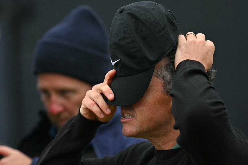 Rory McIlroy reacts after making a bogey on the 18th green at the end of his first round. Photograph: Glyn Kirk/AFP via Getty Images