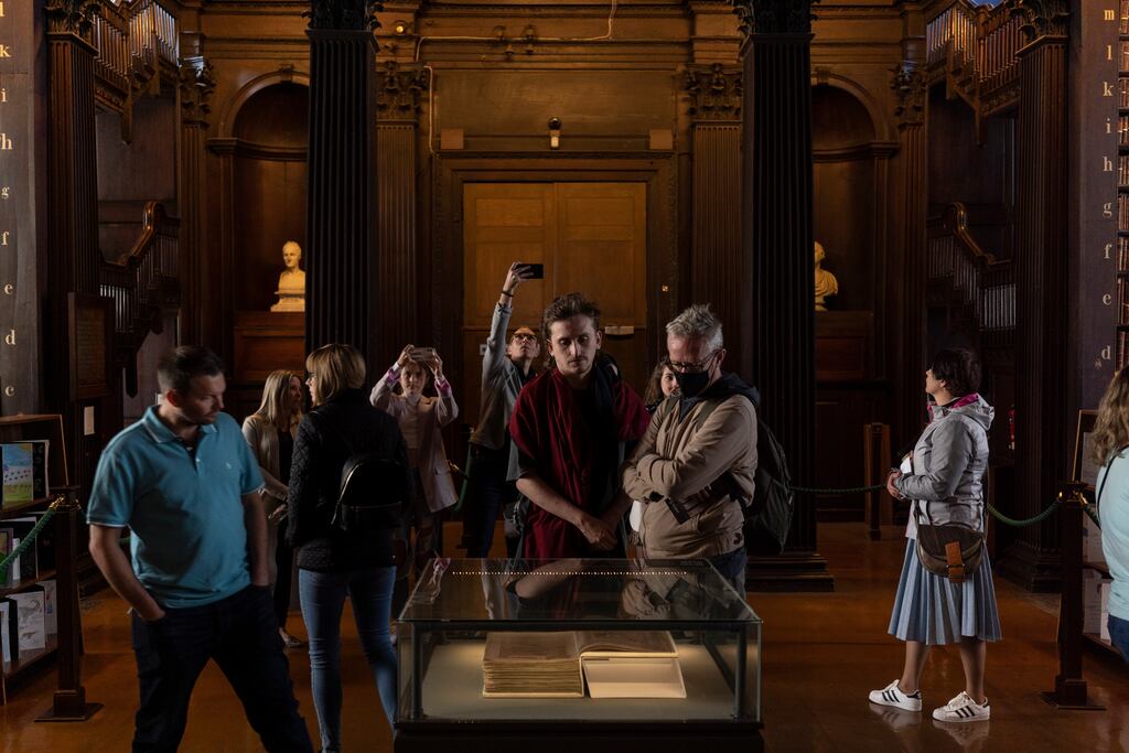 Tourists visit the Long Room at Trinity College Dublin’s Old Library. On staycations in Ireland, guidebooks can inspire you to look closer at the treasures on your doorstep. Photograph: Paulo Nunes dos Santos/The New York Times