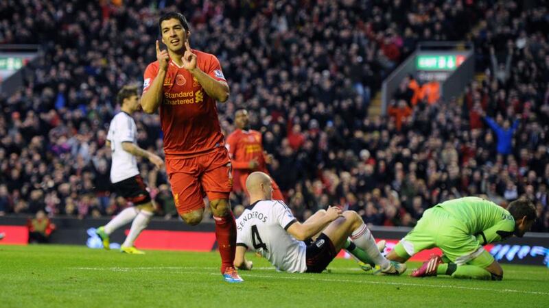 Liverpool’s Luis Suarez celebrates scoring their fourth goal, his second, against Fulham at Anfield. Photograph: Peter Byrne/PA Wire