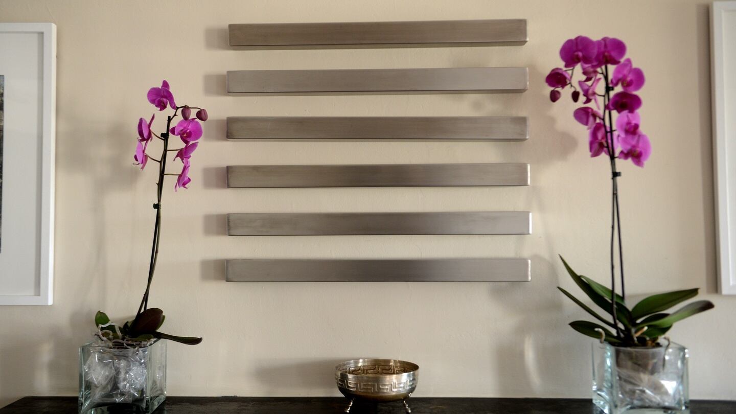 Sculpture by Corbin Walker above a fireplace