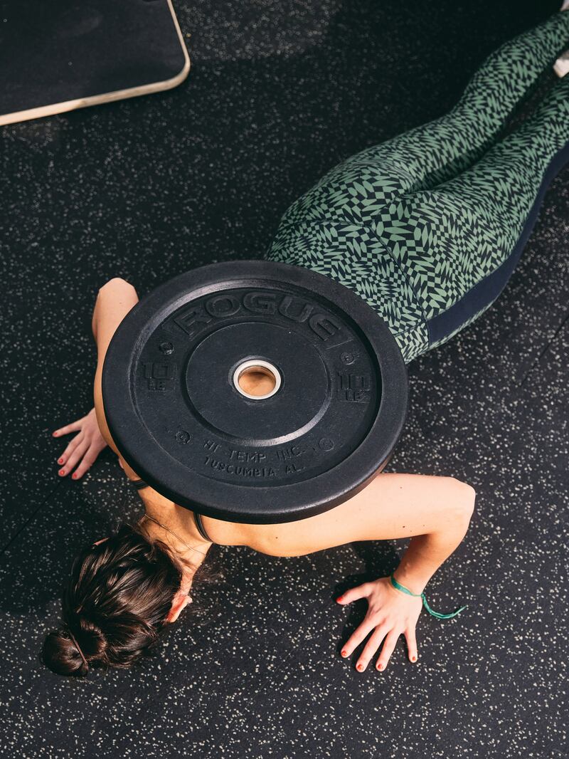 Try weighted push-ups if standard ones are too easy. Photograph: Zack DeZon/The New York Times